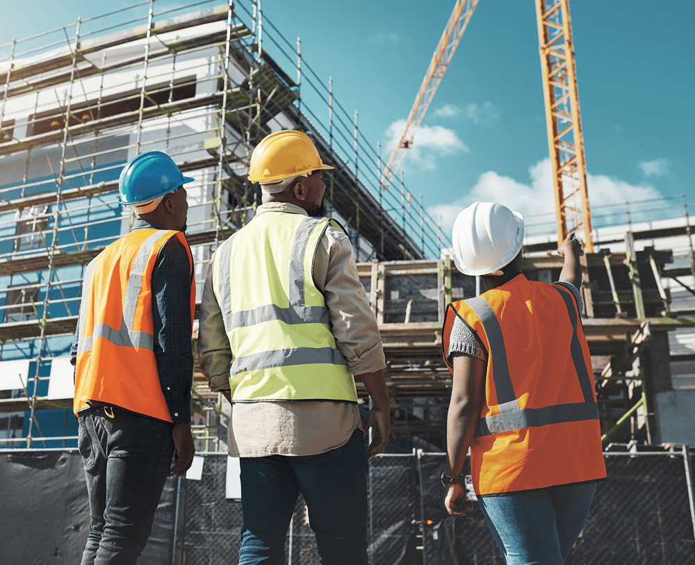 Engineers discussing project at construction area